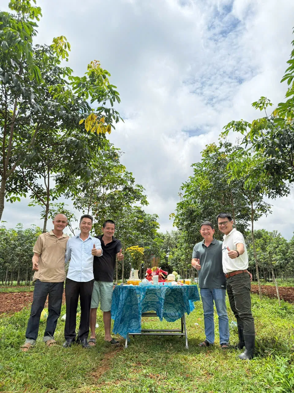 Thumbs up: the founding team at the ceremony table